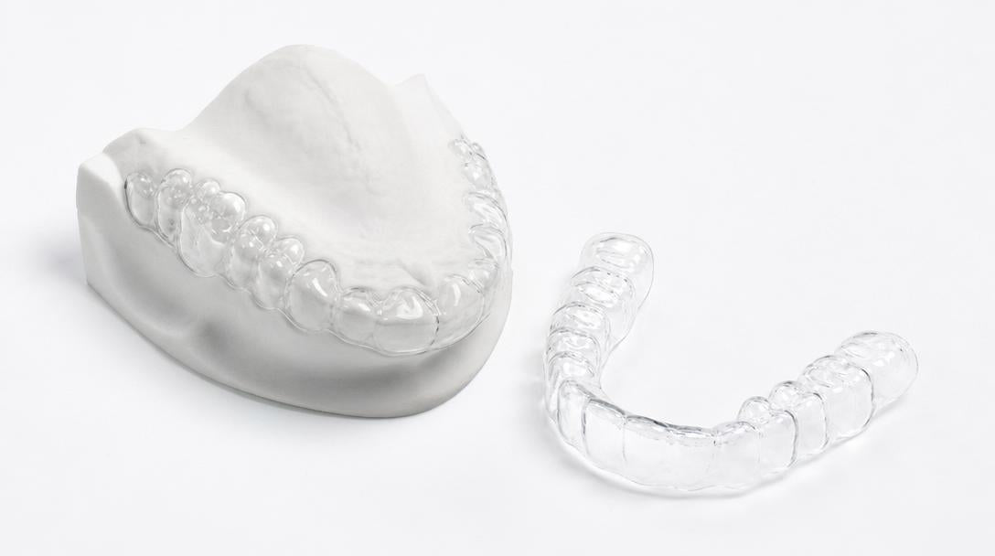 custom clear Essix retainers on surface — replacement retainer Australia 2026